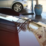 Before and after photographs of a damaged Porsche that was repaired by Elite Paint & Body Shop in West Palm Beach, Florida.